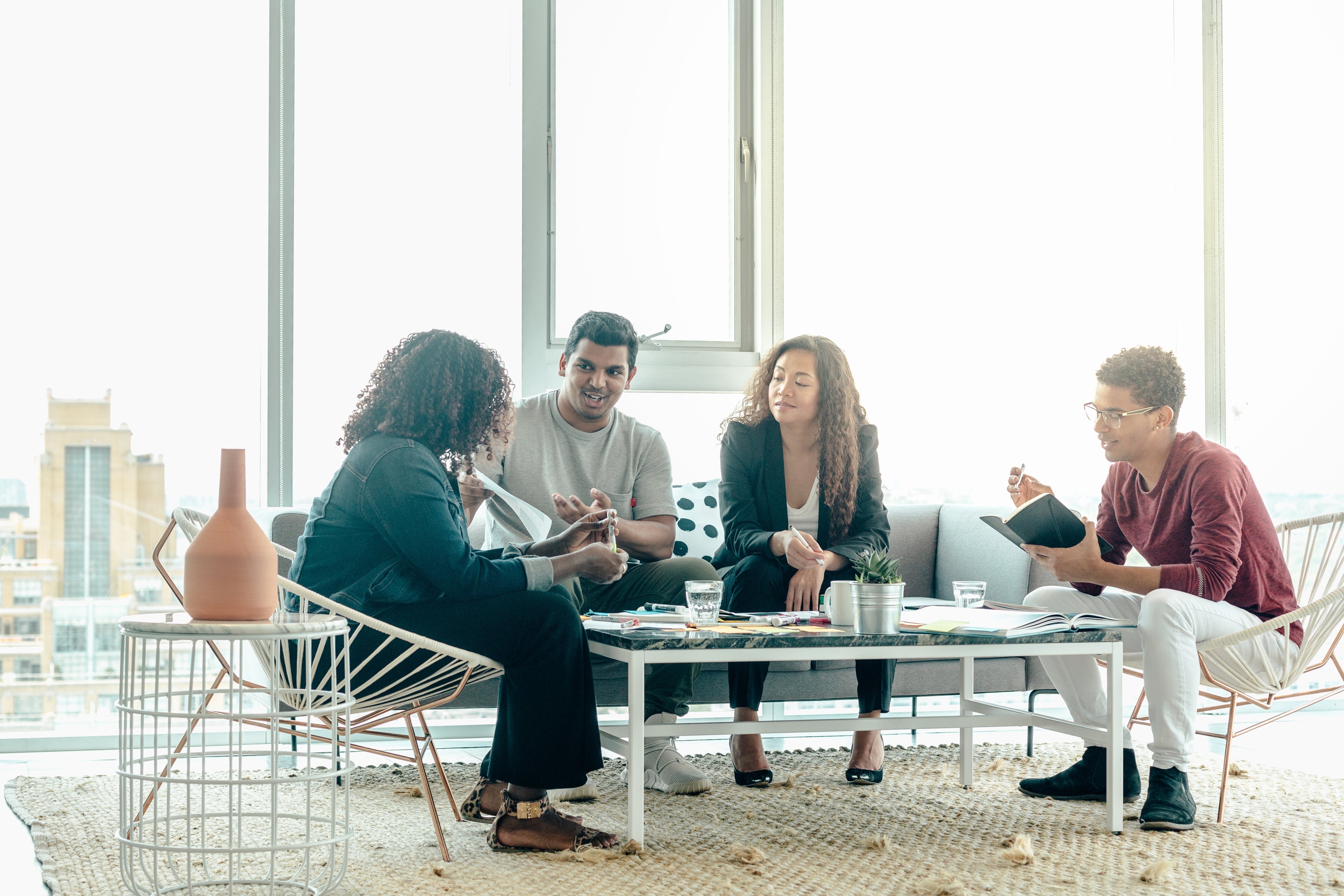 team-brainstorm-meeting-in-bright-sunny-office_1.jpg